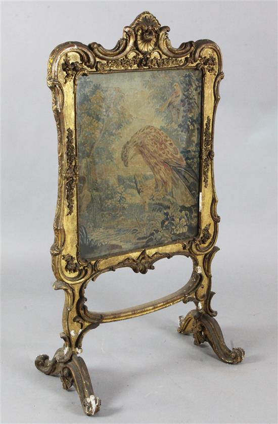 A Victorian giltwood firescreen 2ft 10in. H.3ft 10in.